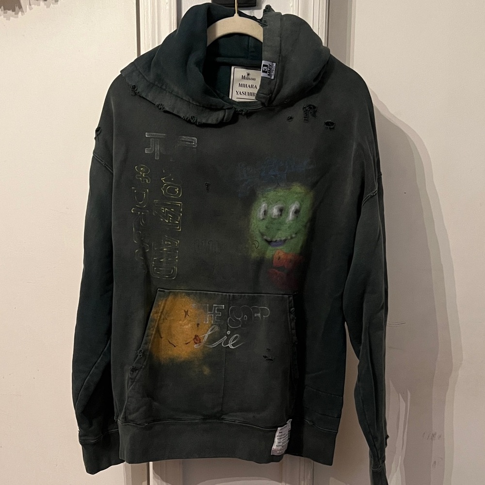 Edgy Graphic Hoodie with Distressed Look Maison Mihara Yasuhiro